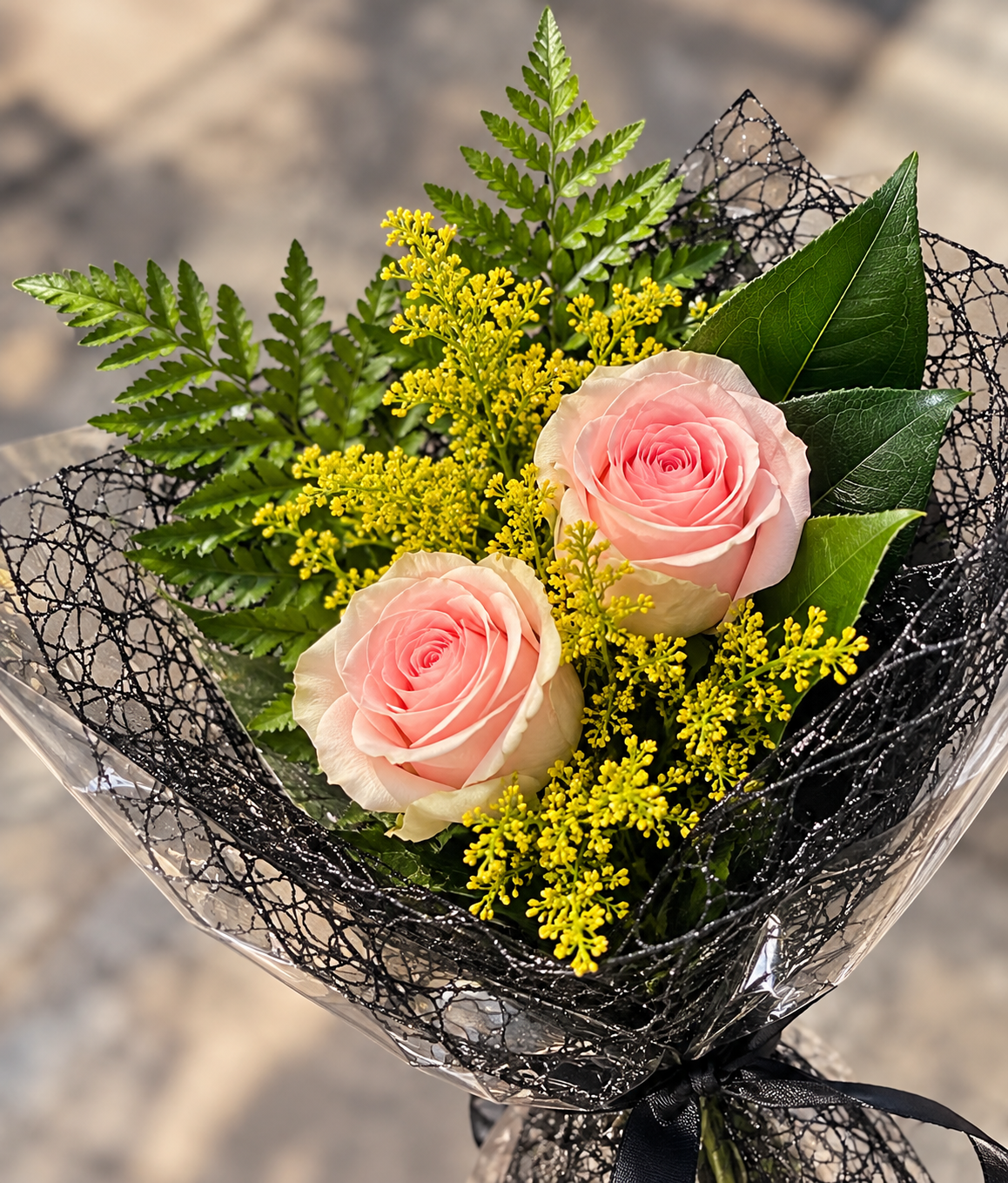 elegant pink rose bouquet with golden filler flowers